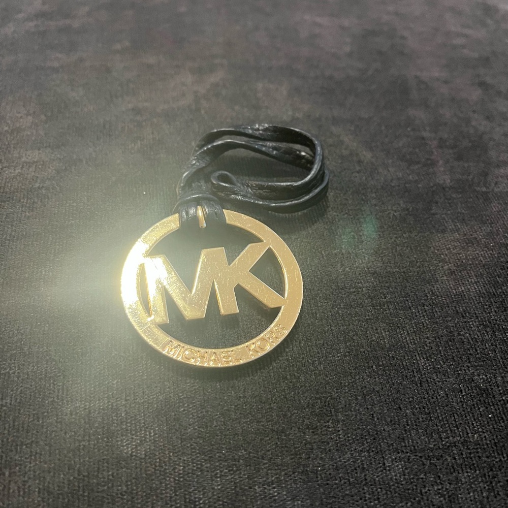Michael Kors Purse Charm on Black and Gold - fair condition